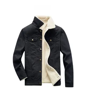 Detail of black winter workwear jacket with thick white sherpa fleece lining and collar