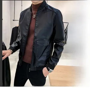 Detail of black bomber jacket with metal zipper and ribbed cuffs on male model