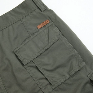 Olive green cotton cargo shorts with flap pocket and freedom leather label detail