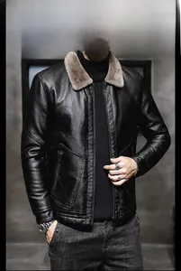 Detailed close-up of a men's black faux leather jacket featuring a warm grey fur collar