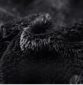 Macro shot of thick black faux lamb wool lining for thermal winter jackets