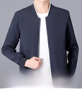 Detail of navy blue slim fit bomber jacket with ribbed cuffs and zip-up closure