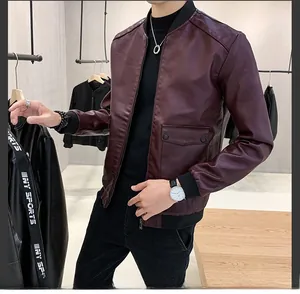 Detailed view of burgundy PU leather jacket with ribbed cuffs and large flap pockets