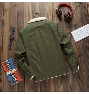 Detail view of army green winter cargo jacket featuring thick white fleece lining and collar
