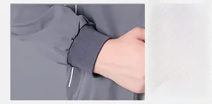 Detailed view of elastic ribbed cuffs on a casual men's grey bomber jacket