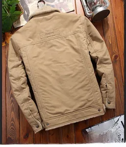 Detailed view of khaki cotton jacket with beige fleece collar and fashion leather patch