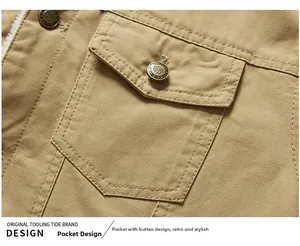 Detail of khaki outdoor jacket showing cargo pocket with metal button and fleece lining