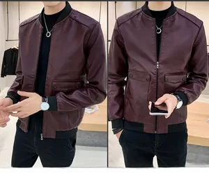 Detail of burgundy PU leather bomber jacket with flap pockets and ribbed cuffs