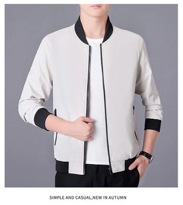 Détail d'une veste décontractée pour homme avec col côtelé noir et tissu crème