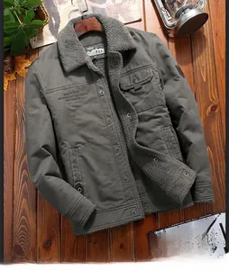 Detail of winter men's jacket featuring lamb wool collar and warm fleece lining in dark green