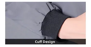 Détail de la veste d'extérieur grise montrant des poignets élastiques coupe-vent
