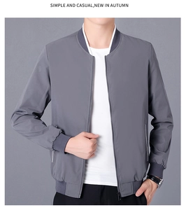 Detail of dark grey bomber jacket with ribbed baseball collar and metallic zipper
