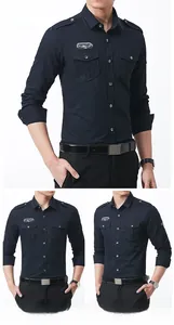 Detail of deep blue pure cotton shirt featuring epaulettes and chest patch embroidery