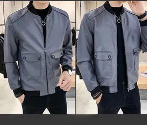 Close-up of dark grey PU leather jacket featuring cargo pockets and ribbed collar details