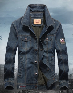 Close-up of heavy cotton denim jacket with vintage flag patches and embroidery details