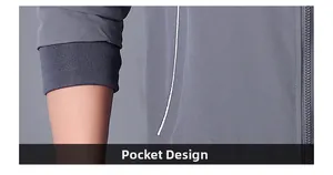 Detail of grey jacket showing zipper closure, ribbed cuff and pocket with white trim