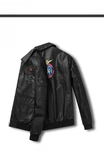 Detail of black faux leather jacket with B.P.N embroidery and ribbed cuffs