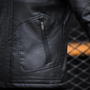 Men's winter black faux leather jacket featuring premium sheepskin texture and zipper pocket