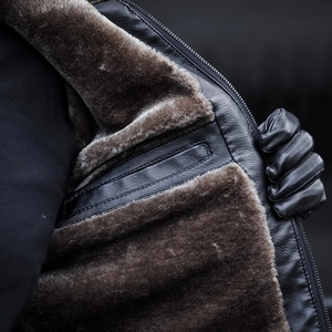 Winter men's leather shearling jacket with thick fleece lining and luxury texture
