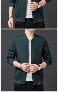 Détail du blouson de baseball vert foncé montrant la texture mesh et le col côtelé