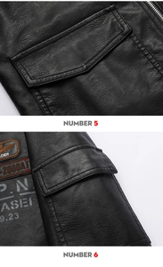 Detail of biker jacket showing embroidered wing patch and metal zipper pocket