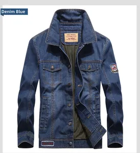 Detail of blue denim jacket showing Outdoor neck label and Est 1961 red woven tag