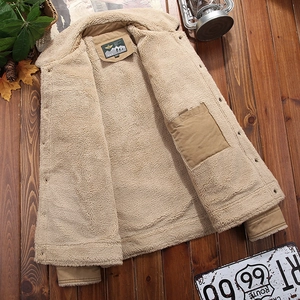 Men's winter heavy jacket with warm sherpa fleece lining and ribbed cuffs on wood floor