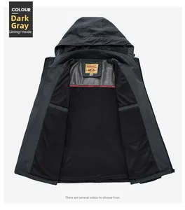 Detail view of dark gray hooded jacket featuring black breathable mesh lining and neck label