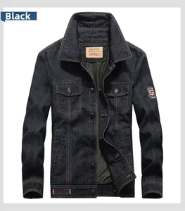 Detail of classic dark blue denim jacket featuring vintage patches and metal buttons