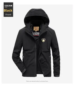 Detail of black hooded windbreaker jacket showing inner collar label and chest badge
