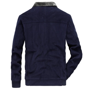 Back view of men's dark blue corduroy jacket with grey fur collar and ribbed cuffs