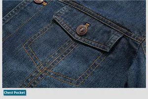 Detail of high-density denim jacket featuring a flap pocket with bronze fashion buttons