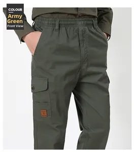 Detail of army green cargo pants featuring an elastic waist and a leather logo pocket