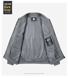 Detail of dark grey men's jacket with breathable mesh lining and inner pocket tag