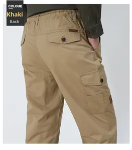 Detail view of khaki cargo pants featuring an elastic waist and flap pockets for men