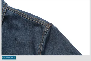 Detailed view of dark blue denim jacket shoulder with reinforced orange double stitching