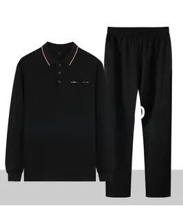 Detail of middle-aged men's black polo tracksuit with red-white striped collar and pocket