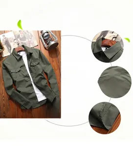 Detail view of cotton military shirt showing collar and double chest pocket stitching