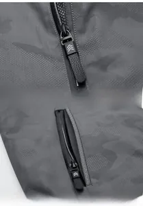 Detail of grey camo jacket featuring durable zippers and practical side pockets