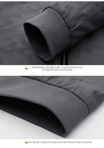 Detail view of the windproof ribbed cuffs and minimalist hem of this grey camo jacket
