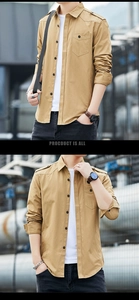 Detail of khaki slim fit utility shirt featuring shoulder epaulettes and chest pockets