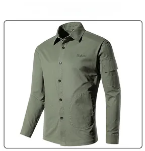 Detail of army green cargo shirt showing fashion embroidery and functional pocket