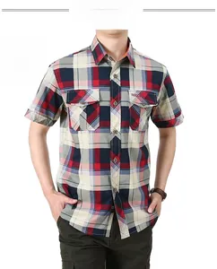 Detail of red plaid short sleeve men's shirt with dual flap pockets and fashion label
