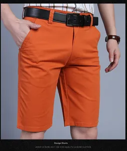Detail view of cotton casual orange shorts with side pockets and a stylish leather belt
