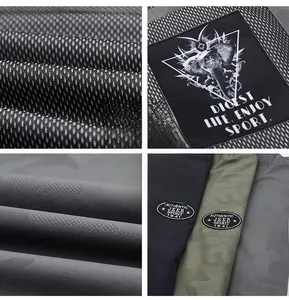 Detailed macro view of athletic mesh fabric and authentic embroidered brand patches