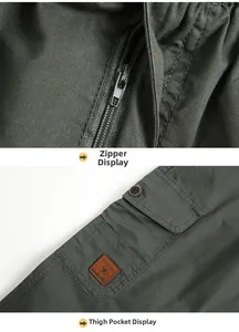 Detail of army green cargo pants featuring metal zipper fly and pocket with Freedom patch
