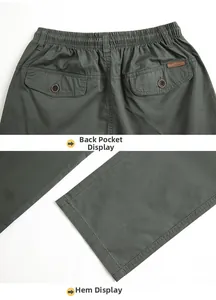 Detail of elastic waist and button flap back pockets on these men's casual cargo trousers