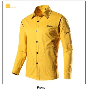 Detail of ginger yellow cargo shirt showing embroidered text and utility flap pockets