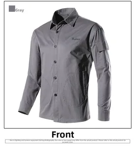 Detail of dark grey workwear shirt with embroidered pocket and twill texture