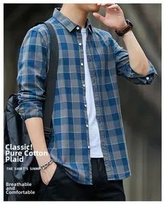 Detail of blue-gray plaid cotton shirt featuring crisp collar and button-down front